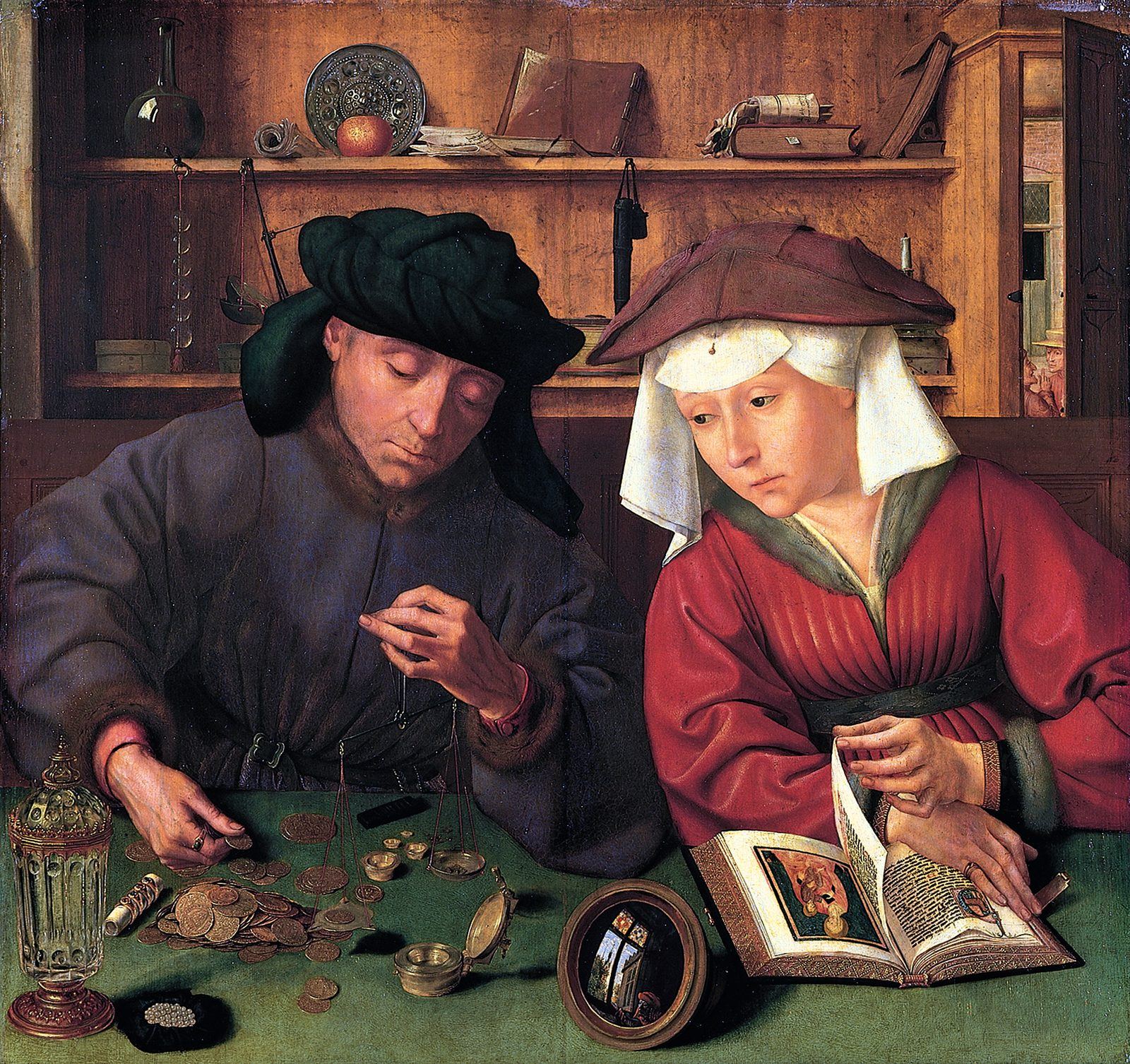 A moneylender weighs coins while his wife turns the pages of a book